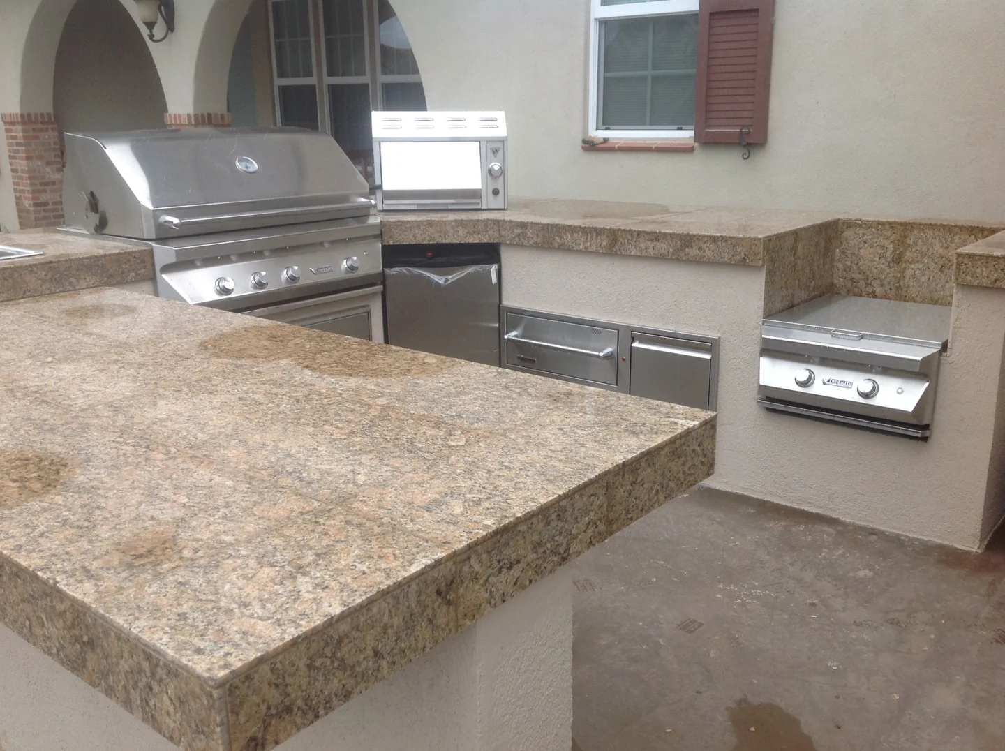 Outdoor kitchen with a wraparound counter