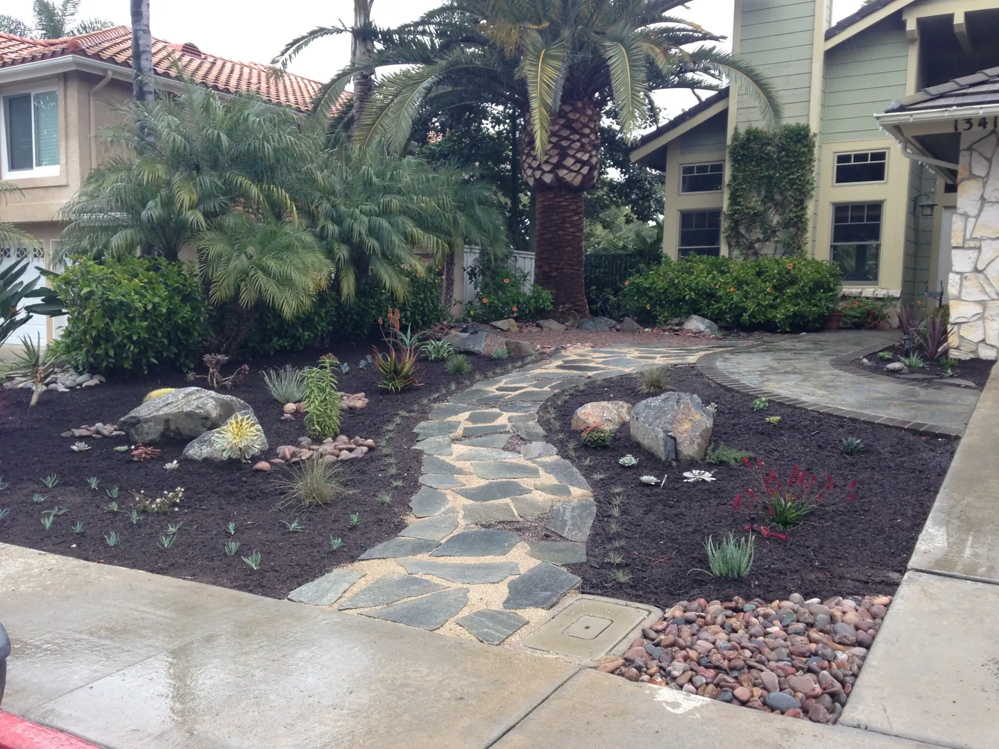 A stone path through the front garden