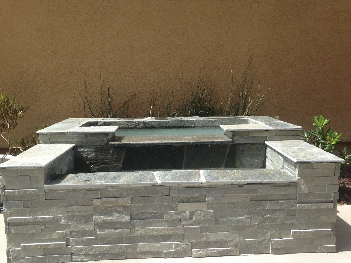 A tiered stone water feature