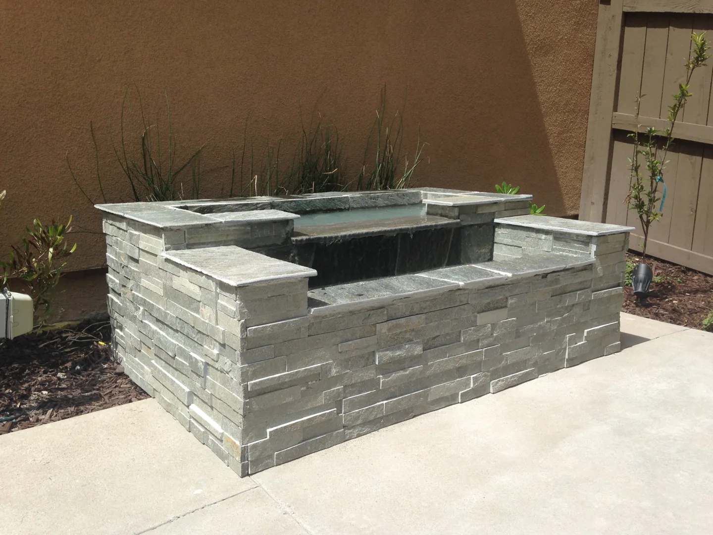A side view of the tiered water feature
