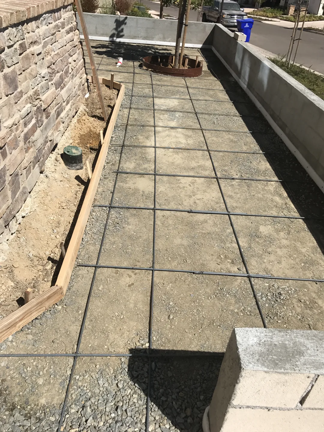 A narrow path beside the stone wall