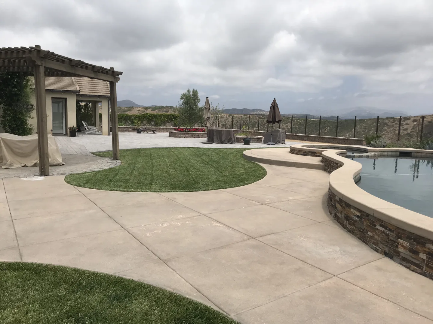 Lawn meeting the poolside terrace