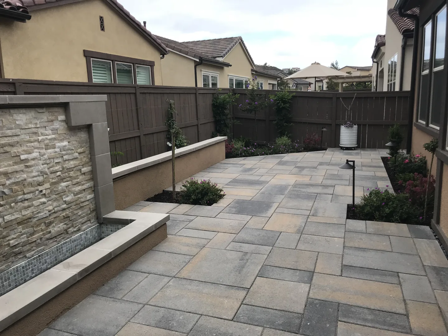 A walkway beside the water feature