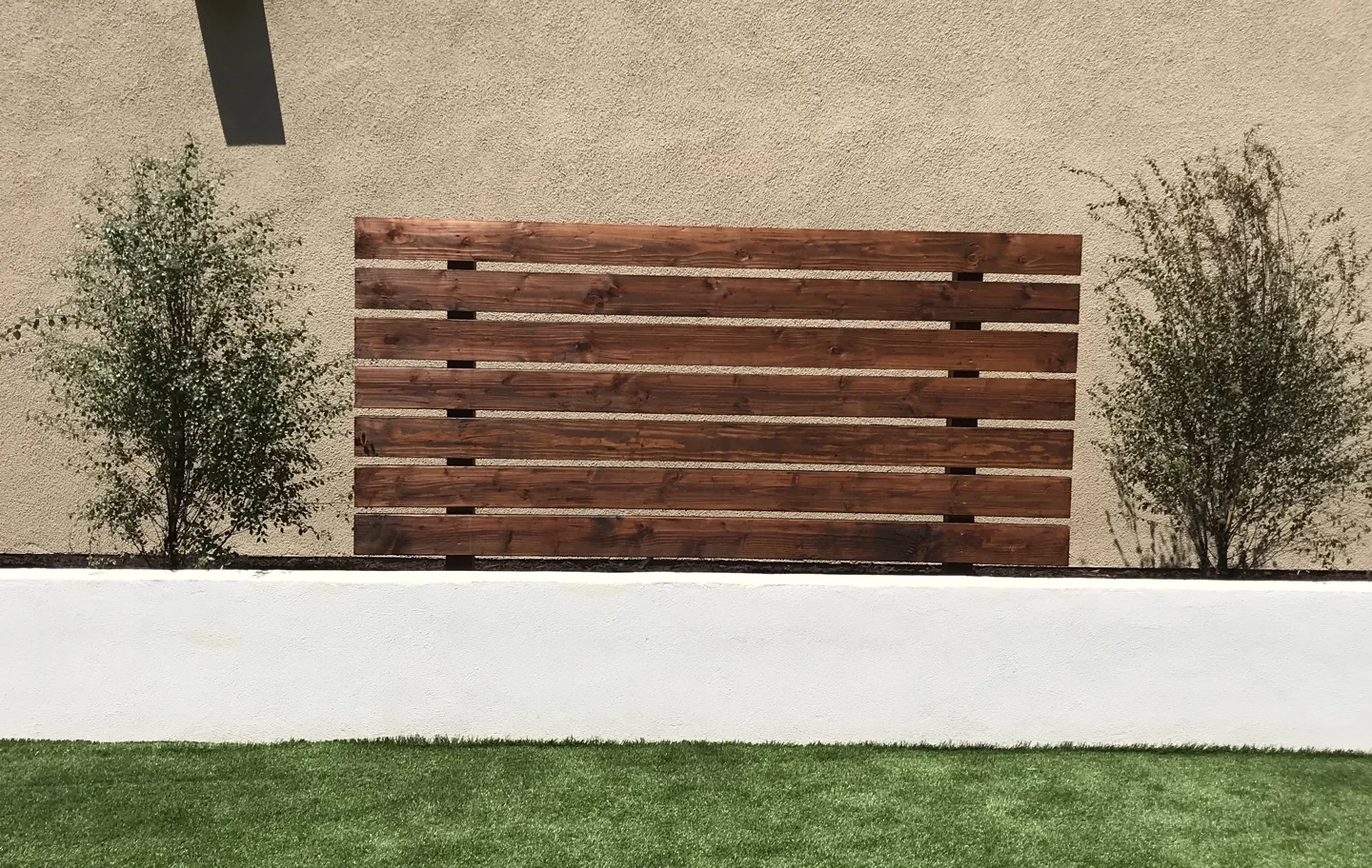 Wood screens and planting borders